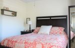 Upstairs Bedroom with Queen Bed at Coastal Cottage